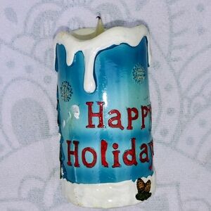 Festive Blue and White Holiday Candle with Red Text